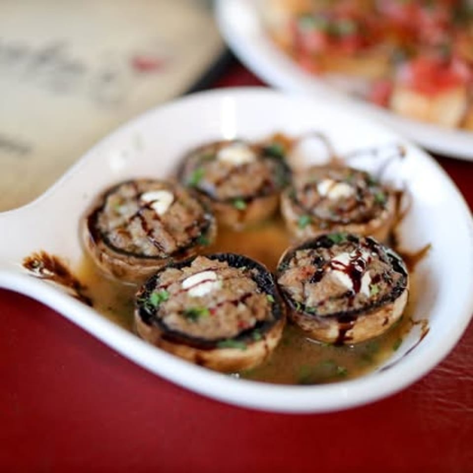 Stuffed mushrooms with balsamic drizzle.