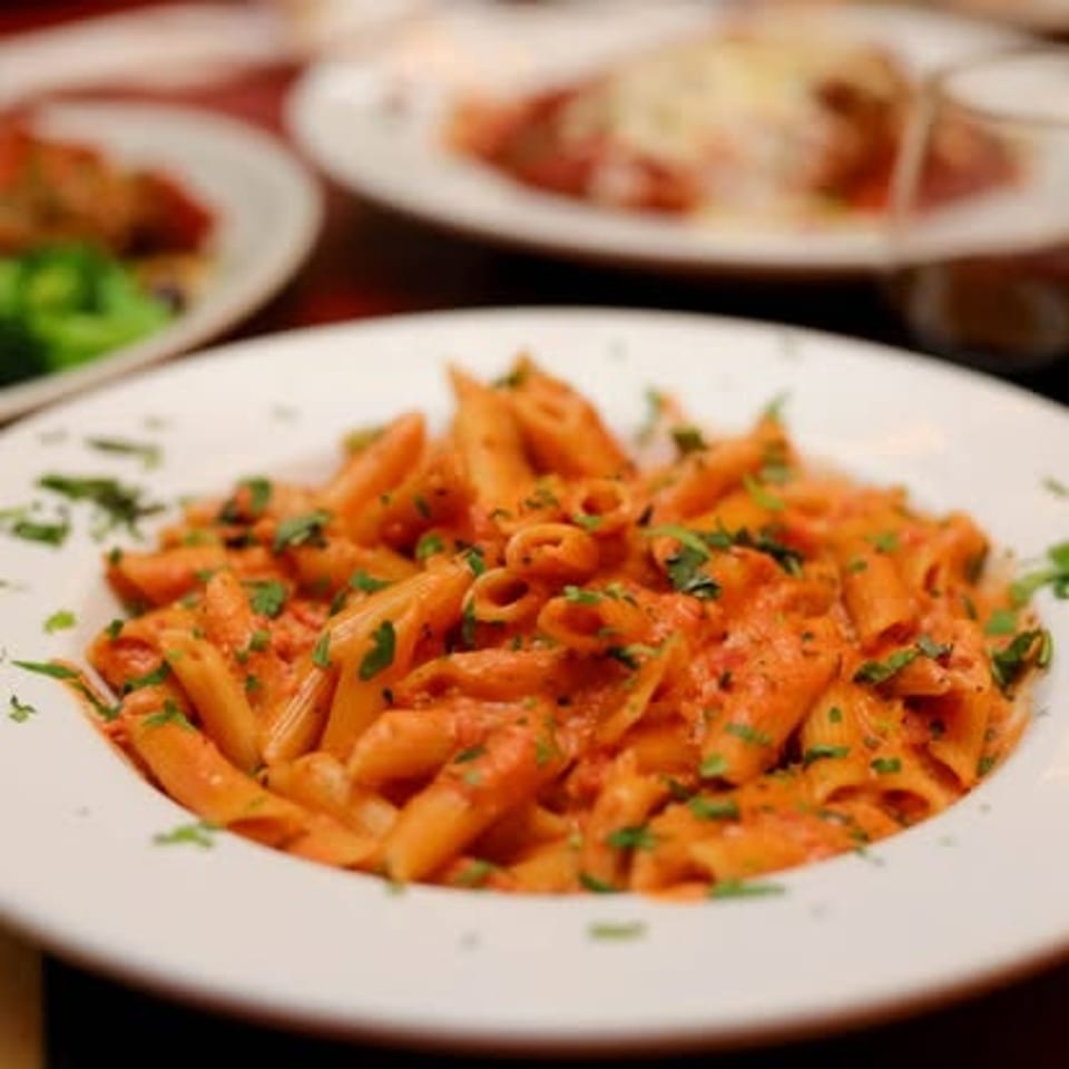 Penne pasta in a tomato cream sauce.